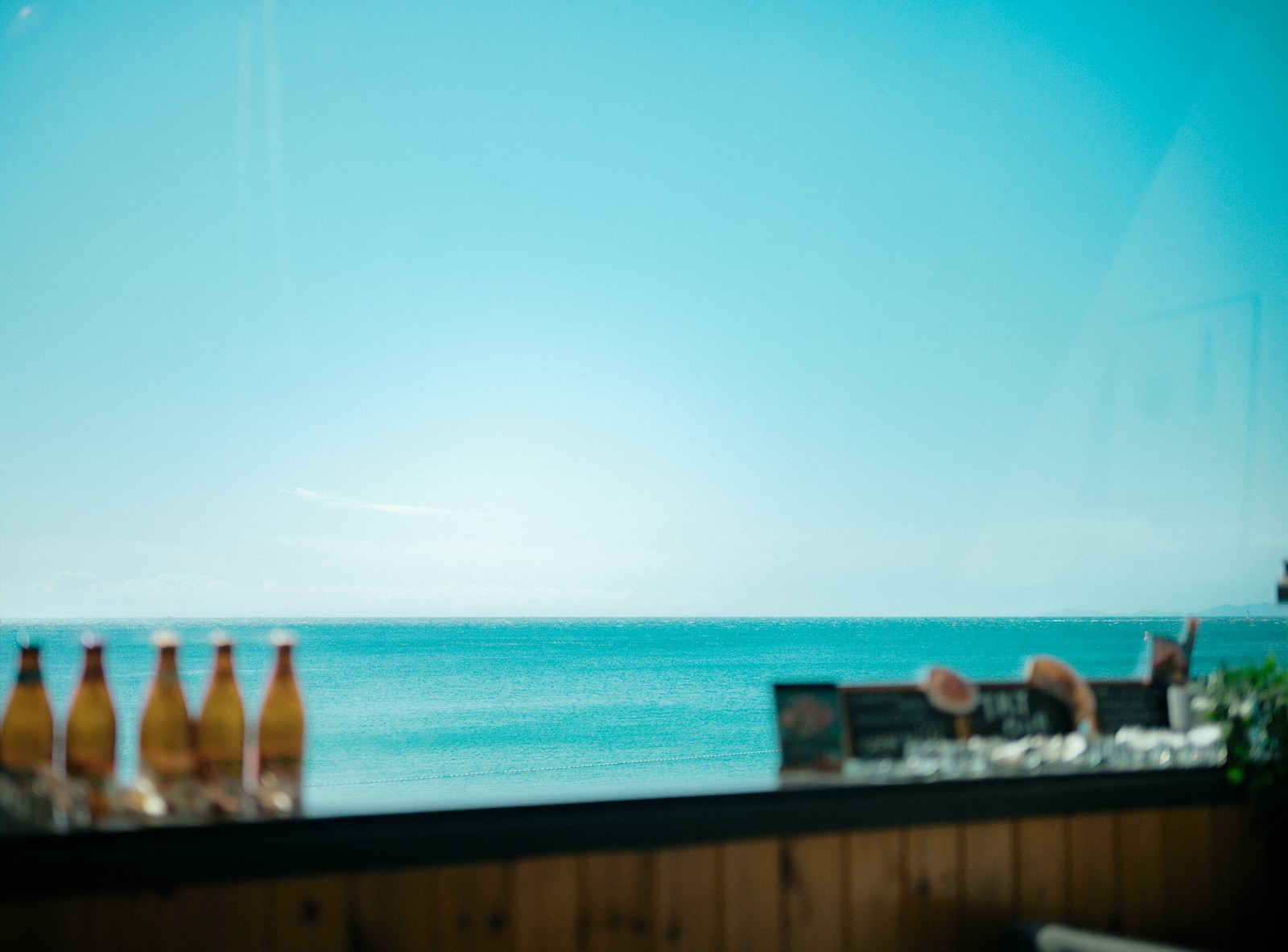 a view of the ocean from a restaurant window
