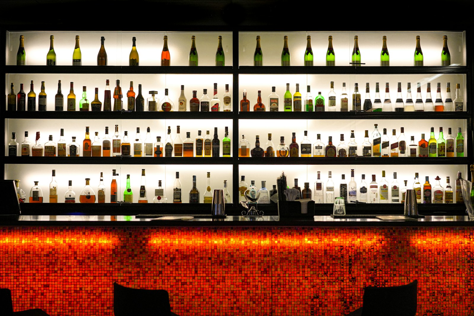 brown wooden bottle rack with bottles